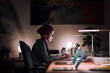 © Studio Marmellata - A dedicated young Moroccan Arab Muslim woman works on her laptop in her home office at night. She is focused on her tasks in the quiet space.