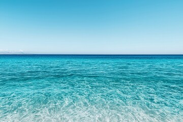 Aufkleber - Calm turquoise ocean reflecting pristine blue sky on sunny day