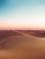 Wall Mural - Serene Desert Landscape at Dusk with Soft Sands and a Dreamy Sky Transitioning from Blue to Pink