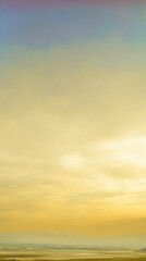 Wall Mural - Serene Landscape View with Golden Sky and Soft Clouds Captured During Sunset in Rural Area Evoking Calmness and Tranquility for Nature Lovers