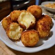 © PrimoStock - Golden-brown, crispy fried cheesecake bites filled with creamy, melted cheese centers.