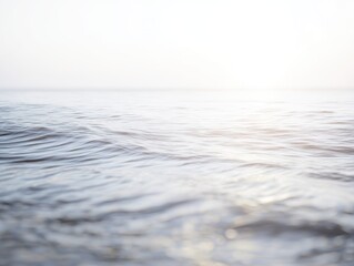 Wall Mural - Tranquil Sea Water Surface Reflecting Soft Light at Dusk Capturing the Serenity and Calmness of Nature and the Beauty of Ocean Waves