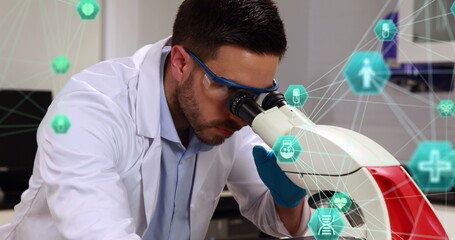 Poster - two globes spinning against male caucasian scientist using binoculars at the laboratory