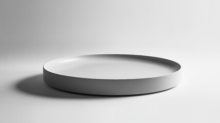 Poster - A minimalist white round tray on a white background, showcasing its simple design and smooth surface.