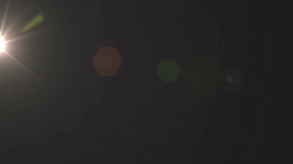 Poster - Bright light source emitting vibrant hexagonal lens flares across dark void, 3D render