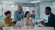 © Zulharyono - Diverse Business Team Collaborating on Investment Strategy with Financial Data Overlay