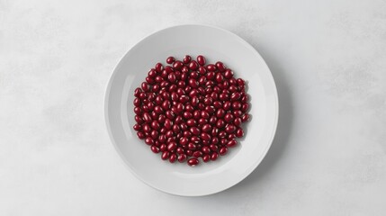 Poster - Red beans on a white plate, overhead view.