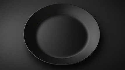 Poster - Overhead view of a single, empty, black plate on a dark background.