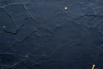 Poster - Close up abstract texture of dark blue slate rock showing its rough surface and detailed cracks with small flecks.