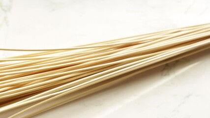 Poster - A collection of bamboo sticks arranged on a flat surface, great for various uses such as decoration or DIY projects