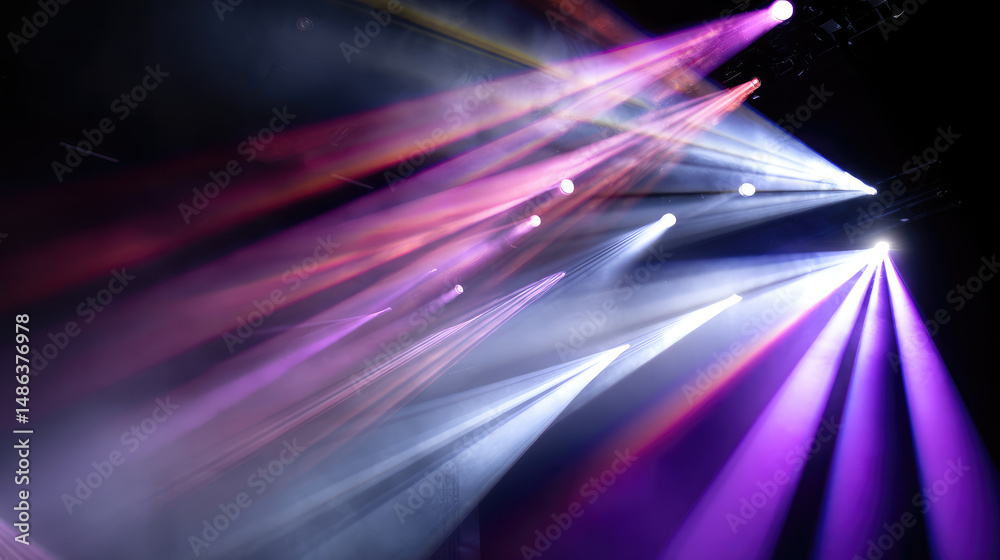 Vivid stage lights cutting through darkness, creating dramatic beams ...