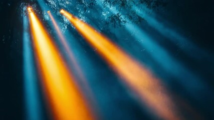 Fototapete - Stage Lights in Atmospheric Setting: Energetic beams of golden and blue light pierce through a hazy ambiance, creating a dynamic visual for any performance or celebration.