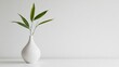 © ADI - Green leaves in white vase minimalist home decor photo