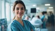 © Daiki - A portrait of a smiling European female nurse in scrubs, confidently standing in a hospital environment. The image conveys professionalism, care, and dedication to patient wellbeing.
