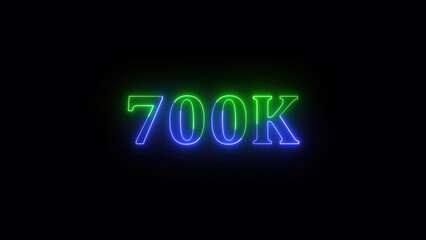 Aufkleber - Glowing neon sign celebrating 700k with a bold display of blue and green illumination against a dark background creating a stylish number.