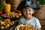 Smiling pirate boy enjoys grilled veggie skewers