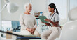 © peopleimages.com - Tablet, doctor and consulting with old woman in office for patient records, insurance and physiotherapy plan. Healthcare, rehabilitation and medical help with people in clinic for advice and results