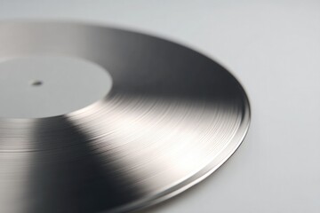 Poster - close-up of iconic vinyl record reflecting light on its metallic grooves on plain white surface