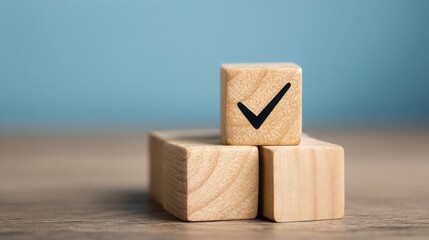 Poster - Wooden block featuring a tick symbol illustrating the concept of prioritizing tasks and achieving goals