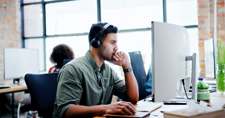 Leinwandbilder - Computer, music and thinking with business man at desk in office for planning or problem solving. Headphones, solution and troubleshooting with employee in workplace to search internet for ideas
