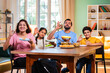 © StockImageFactory - Indian family enjoying golgappa at home while sharing love, laughter, and delicious street food