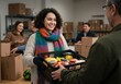 © Ozz - A cheerful woman offers a crate of food to someone, part of a food bank service project.