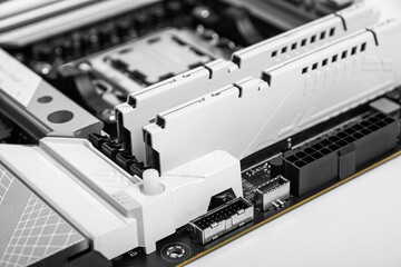 Poster - Two white RAM modules installed in a modern motherboard, highlighting precision engineering and stylish PC component design.