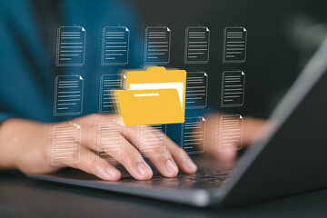 Leinwandbilder - Businessman managing digital documents and folders on laptop with hologram interface, symbolizing data storage, cloud computing, file management, digital organization, and online information security