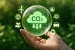 © KP Creative Stock - CO2 Reduction:  A hand gently cradles a transparent bubble containing a green cloud with the inscription 'CO2', signifying the reduction of carbon dioxide emissions.