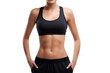© Oksana_Latysheva - Woman's Midsection in Black Sportswear  Isolated On White Background. Woman in Sportswear Showing Abdominal Muscles