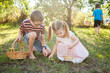 © Austockphoto - Children finding colourful eggs on an Easter egg hunt
