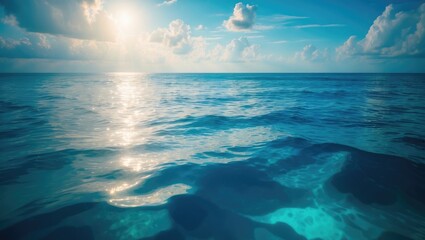 Wall Mural - blue waters and the sun illuminating the sky