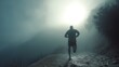 © Adi - male runner pushing through exhaustion on a foggy mountain trail, their face glowing with determination--evoking resilience and triumph