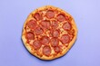© Diki prayoga - Pepperoni pizza on purple background flatlay