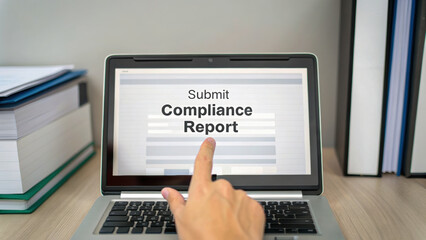 Poster - Submit compliance report on laptop screen with hand gesture, showcasing digital documentation. tax deal compliance