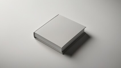 Poster - Closed blank square book mockup set against a textured paper background.
