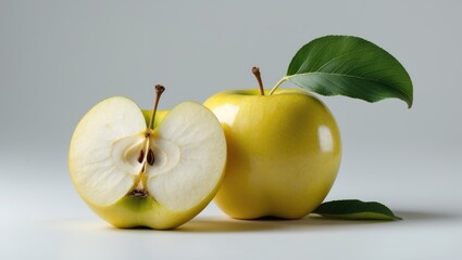 Aufkleber - Yellow ripe apple fruit with a green leaf and half an apple isolated on a background