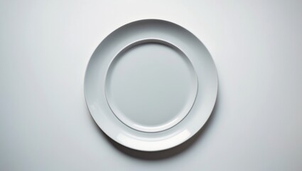 Poster - Empty white plate on a white surface. Aerial perspective