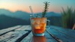 © Rizvan - Iced tea in a glass with a straw placed on a wooden table, garnished with a sprig of rosemary.