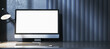 © Who is Danny - Blank computer screen mockup on modern desk with keyboard and lamp against dark striped wall background for design and branding concepts. 3D Rendering