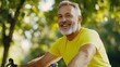 © SnapPik - Happy Senior Man Cycling Outdoors