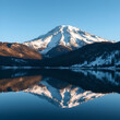 © Timothy - Snow-capped mountain reflected in tranquil lake