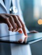 © rfassets - Doctor's hand touching tablet screen, medical technology and digital health