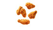 © Lilimanatasa - Fried chicken pieces flying in the air, isolated on a white background, cut out