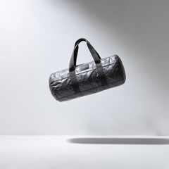 Poster - Elevated Style: A Modern Black Duffle Bag Suspended in Mid-Air with Elegant Shadow Detail Against a Minimalist White Background