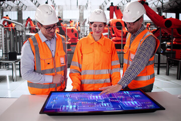 Leinwandbilder - Man And Woman Using Computers Monitoring Production
