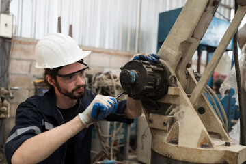 Leinwandbilder - Robotic arm, Automatic robotic arm welding. Robotic manufacturing industry. Engineer setup, install, maintain, repair mechanism of operation of robotic arm in storage warehouse