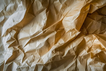 Poster - Textured macro photograph of crumpled brown paper showing folds creases and shadows emphasizing paper material and artistic composition