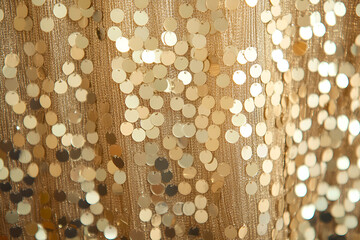 Poster - Elegant close up view of a luxurious gold sequin fabric displaying festive celebration and glamour