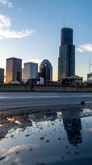 Poster - Stunning City Skyline with Reflections on Wet Windshield at Sunset